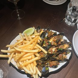 Mussels and fries, tomato salsa base Mussels and fries, tomato salsa base