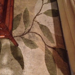 Compass Realty - Stained rug in the living room.