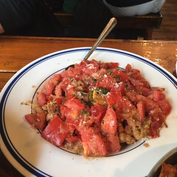 Harvey Cedars Shellfish - flash fried calamari topped with sautéed Jersey tomatoes, cherry peppers, garlic, and parmesan cheese - Seafood Near Me - Harvey Cedars, New Jersey