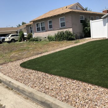 EasyTurf - a front yard with artificial grass and gravel - Landscaping Near Me