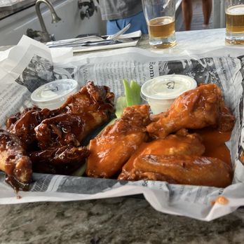 Bitters & Bones - Harissa wings on left, tasted like a love child of a chicken and candy apple, couldn't make out harissa thru the sugar. - American Near Me - Saranac Lake, New York