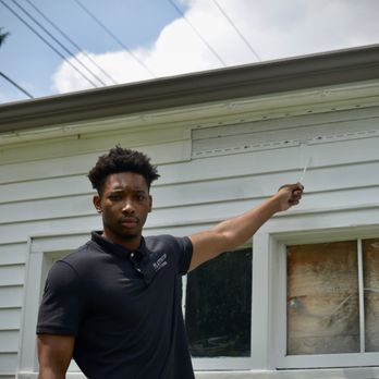 Platinum Inspections - Inspector showing garage defects to home owners - Home Inspectors Near Me Platinum Inspections - Inspector showing garage defects to home owners - Home Inspectors Near Me