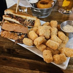 Backwoods Brewing Company - The Turkey Burnt Ends Sandwich with seasoned tots. Similar to a pulled pork sandwich, but with turkey. Was very tasty!