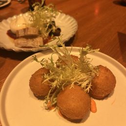 Potato and crab fries croquettes (front) and burrata (back)