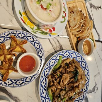 Niyom Thai Kitchen - Chicken pad see-ew, tom kha soup, crab rangoon, roti dip - Thai Near Me - Flushing, New York Niyom Thai Kitchen - Chicken pad see-ew, tom kha soup, crab rangoon, roti dip - Thai Near Me - Flushing, New York