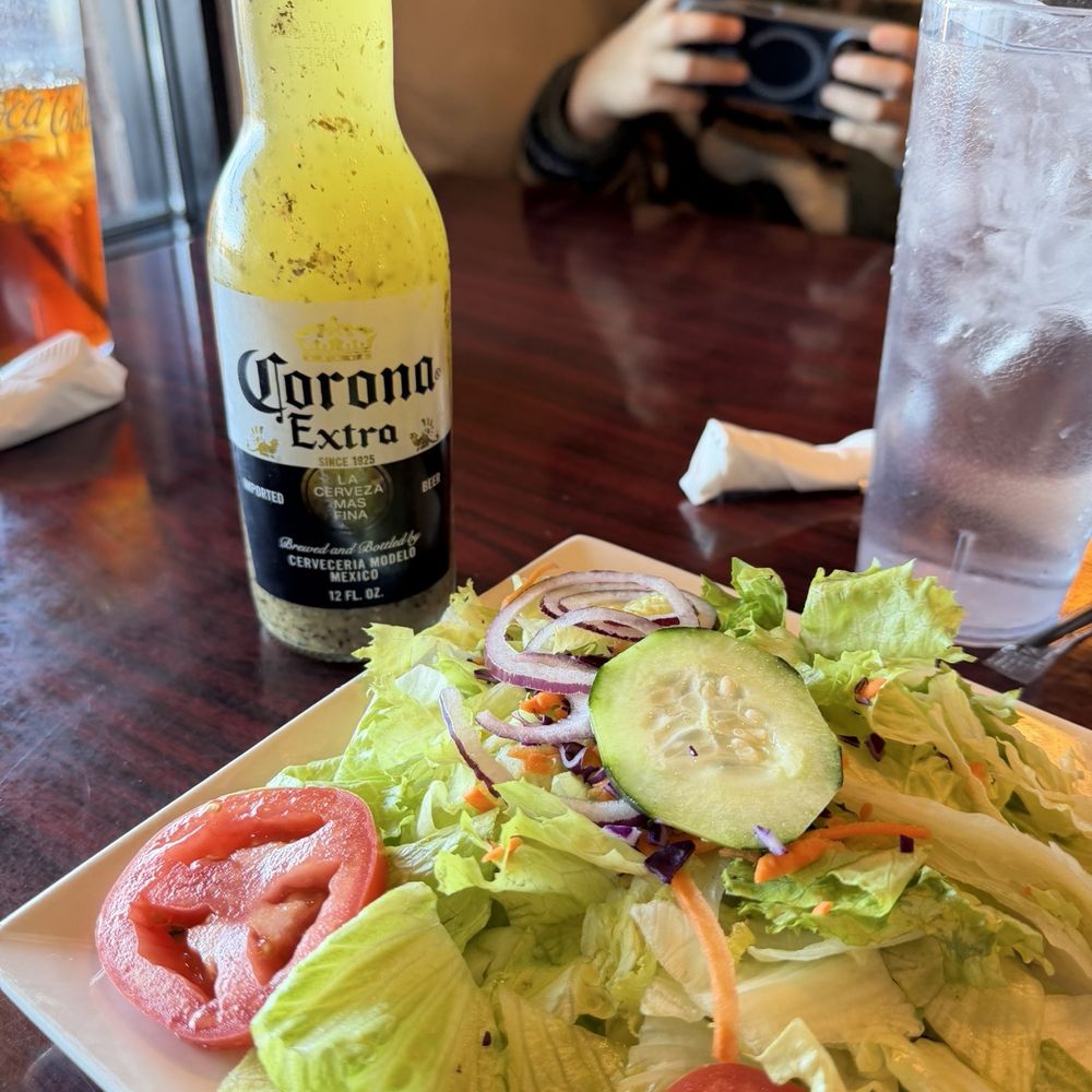 Apollo Flame Bistro - Brevard Rd - Tossed side salad and Greek dressing in the Corona bottle - Greek Near Me - Asheville, North Carolina Apollo Flame Bistro - Brevard Rd - Tossed side salad and Greek dressing in the Corona bottle - Greek Near Me - Asheville, North Carolina