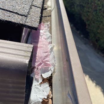 AMECO Solar & Roofing - More trash left in gutters after "clean up" - Solar Installation Near Me - Paramount, California