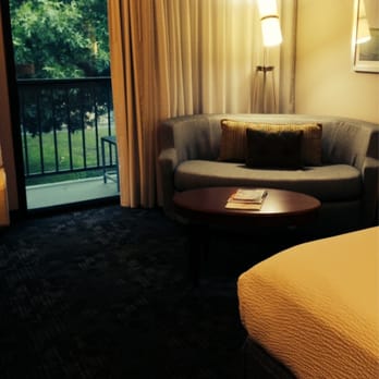 Courtyard by Marriott Dallas Addison/Midway - Small balcony and unique seating area - Hotels Near Me - Addison, Texas