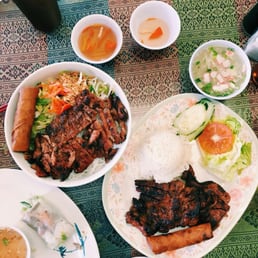 The pork chop rice plate, the pork vermicelli and a side of spring rolls The pork chop rice plate, the pork vermicelli and a side of spring rolls
