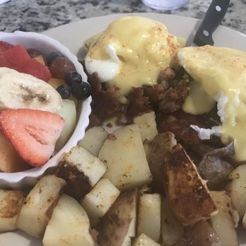 Benedict's Restaurant - Corned Beef Hash Benedict with Breakfast Potatoes + fresh fruit salad - New American Near Me - Dunedin, Florida Benedict's Restaurant - Corned Beef Hash Benedict with Breakfast Potatoes + fresh fruit salad - New American Near Me - Dunedin, Florida