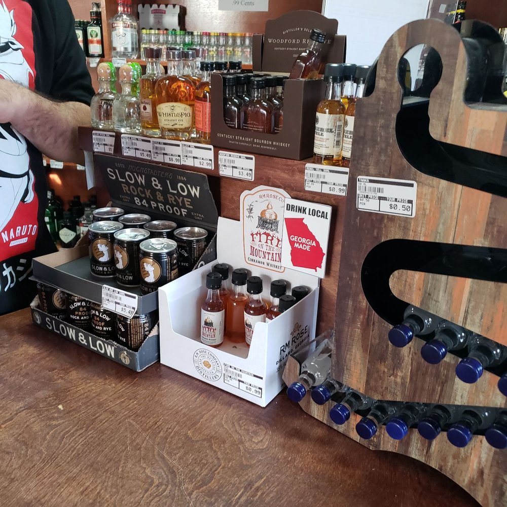 Red Barn Package - a man standing at a bar - Beer, Wine & Spirits Near Me - Cumming, Georgia Red Barn Package - a man standing at a bar - Beer, Wine & Spirits Near Me - Cumming, Georgia