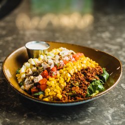 Flanker Kitchen + Sports Bar - Southwest Cobb Salad made with romaine lettuce, grilled chicken, bacon, pepper jack, pico de gallo and grilled corn