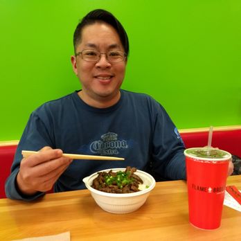 Flame Broiler - Riley with his beef bowl. - Korean Near Me - Greensboro, North Carolina Flame Broiler - Riley with his beef bowl. - Korean Near Me - Greensboro, North Carolina