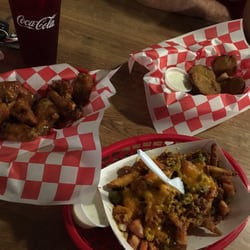 Dawg Pound - Extreme Fries and Wings were legit, but the fried green tomatoes were a little soggy.