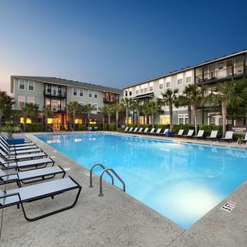 Central Square at Watermark Apartments - Enjoy or large sundeck for our year round swimming pool. - Apartments Near Me - Mount Pleasant, South Carolina Central Square at Watermark Apartments - Enjoy or large sundeck for our year round swimming pool. - Apartments Near Me - Mount Pleasant, South Carolina