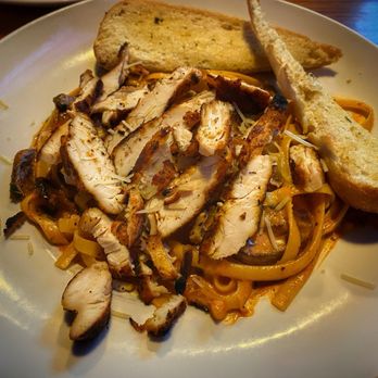 Miller's Ale House - CAJUN CHICKEN PASTA Blackened chicken breast, sautéed mushrooms, tomatoes, scallions, spicy Parmesan cream sauce, fettuccine. - Sports Bars Near Me - Seminole, Florida