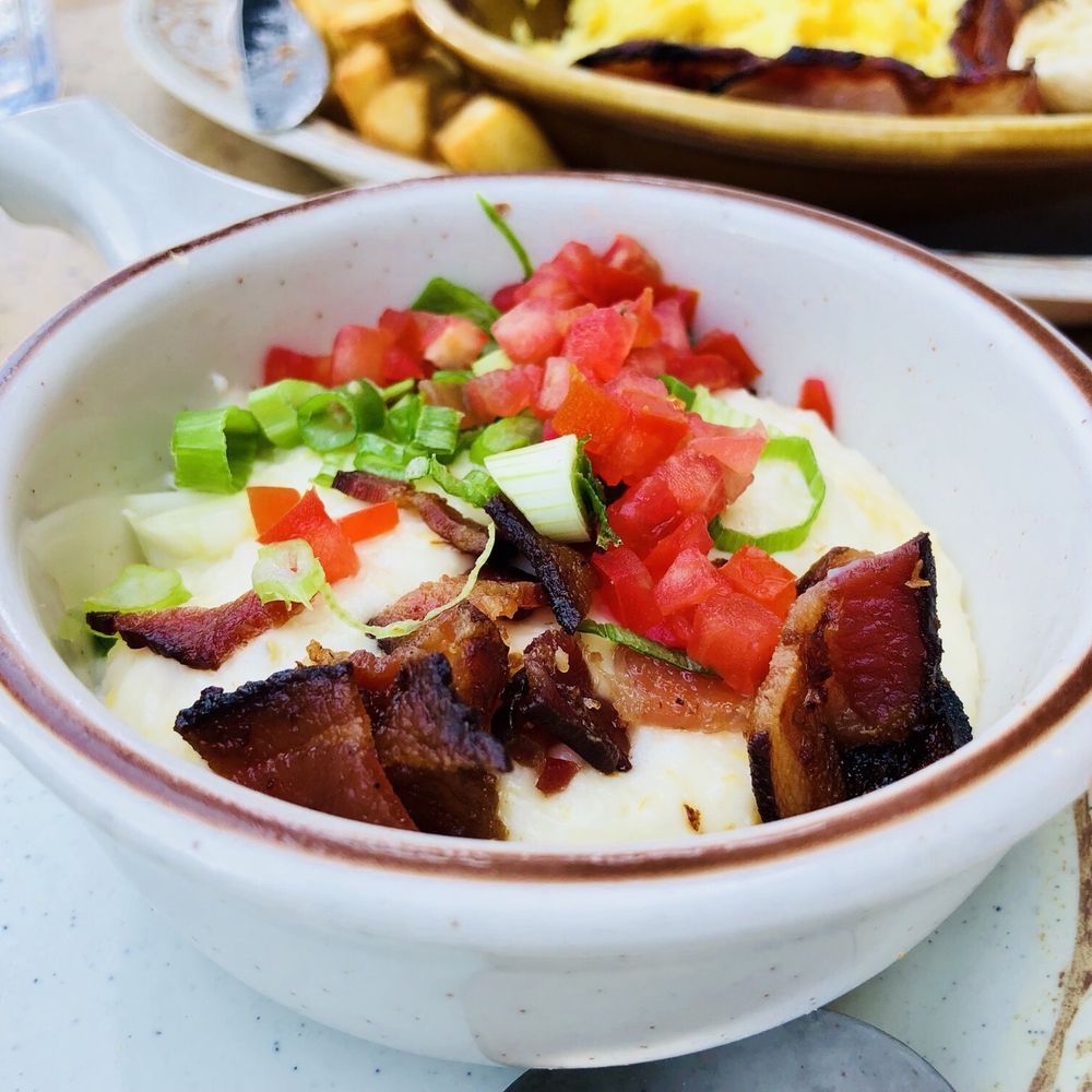 Another Broken Egg Cafe - City grits with smoked Gouda, bacon, and green onions. - Breakfast & Brunch Near Me - Delray Beach, Florida Another Broken Egg Cafe - City grits with smoked Gouda, bacon, and green onions. - Breakfast & Brunch Near Me - Delray Beach, Florida