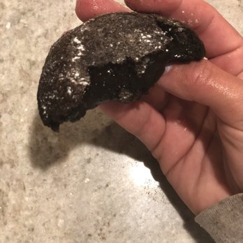 Domino's Pizza - a hand holding a doughnut - Pizza Near Me - Joint Base Lewis McChord, Washington