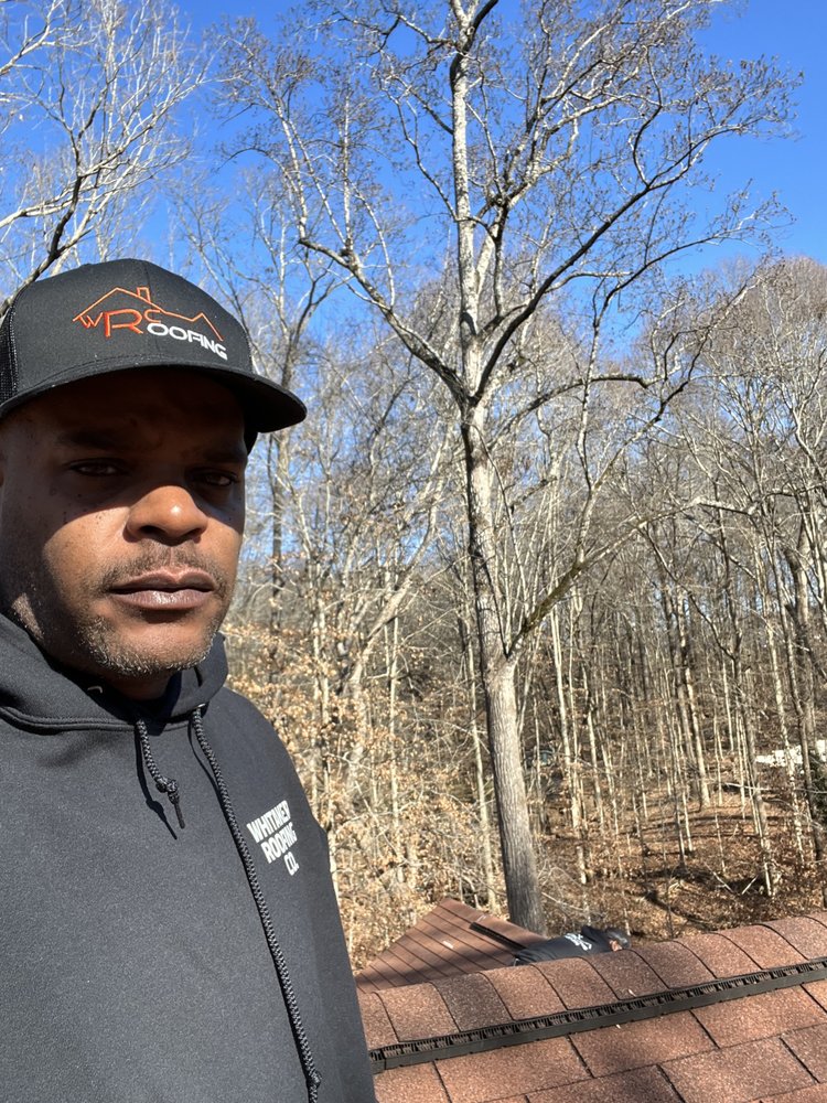 Slide of Whitaker roofing company