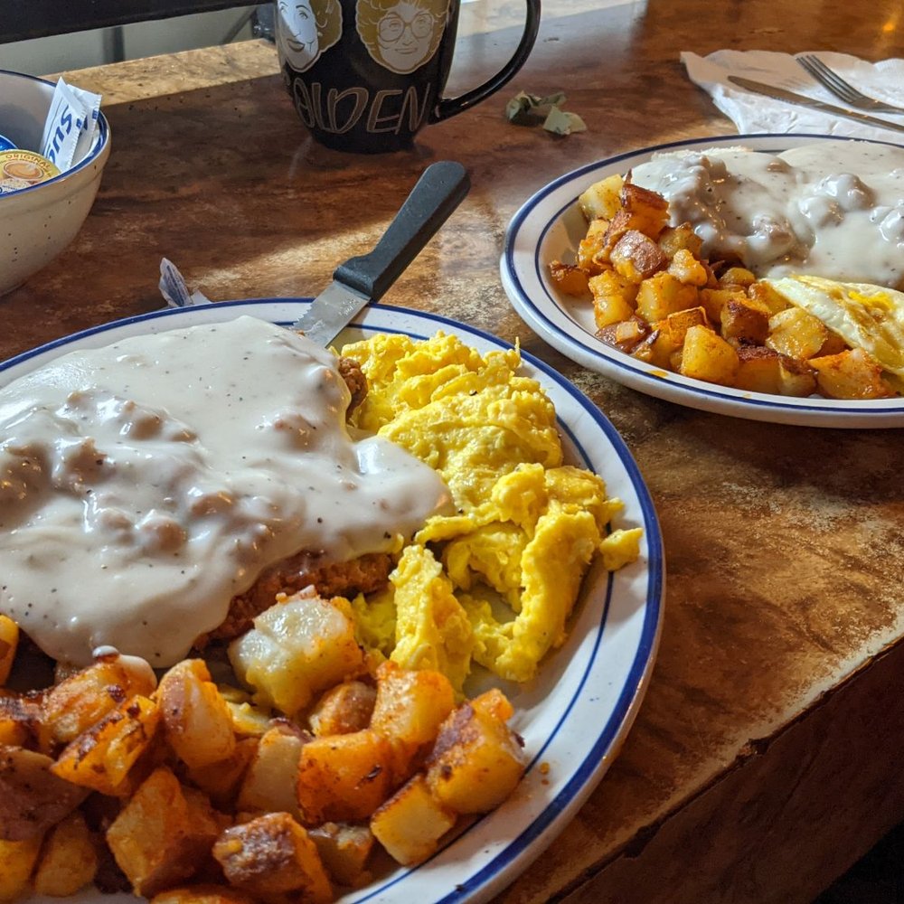 Luxury Diner - Country fried steak on left and biscuits with gravy on the right. - Diners Near Me - Cheyenne, Wyoming Luxury Diner - Country fried steak on left and biscuits with gravy on the right. - Diners Near Me - Cheyenne, Wyoming