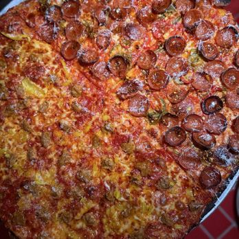 Fratesi's Pizza - Half and half of boy pig and girl pig - Pizza Near Me - Miami, Florida
