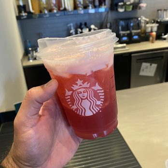 Starbucks - a hand holding a cup of drink - Coffee & Tea Near Me - Edmonton, Alberta