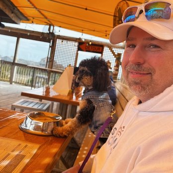 Mulligan's Grille in Historic Cottage Row - Hubs and Teddy up on the top deck. - Seafood Near Me - Nags Head, North Carolina