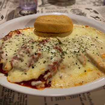 The Grill House - Jumbo Cheese Ravioli Bake: Ravioli w/ grilled chicken and both Italian tomato & Alfredo sauce, topped w/ cheese. Served w/ a roll. - Steakhouses Near Me - Allegan, Michigan The Grill House - Jumbo Cheese Ravioli Bake: Ravioli w/ grilled chicken and both Italian tomato & Alfredo sauce, topped w/ cheese. Served w/ a roll. - Steakhouses Near Me - Allegan, Michigan