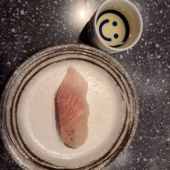 Sushi Murayama - Snow trout with salt and orange zest (amazing), with some hot sake - Sushi Bars Near Me - Honolulu, Hawaii