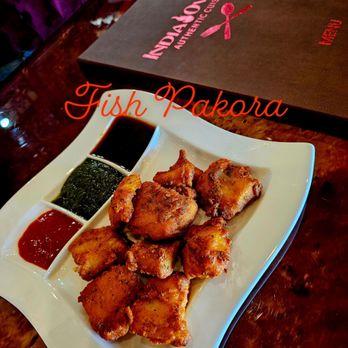 India Oven Auburn - a plate of chicken wings with dipping sauce - Indian Near Me - Auburn, California