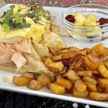 Lola's Farmhouse Bistro - Poached salmon Benedict with fresh fruit and hand cut fries - Italian Near Me - Manakin-Sabot, Virginia