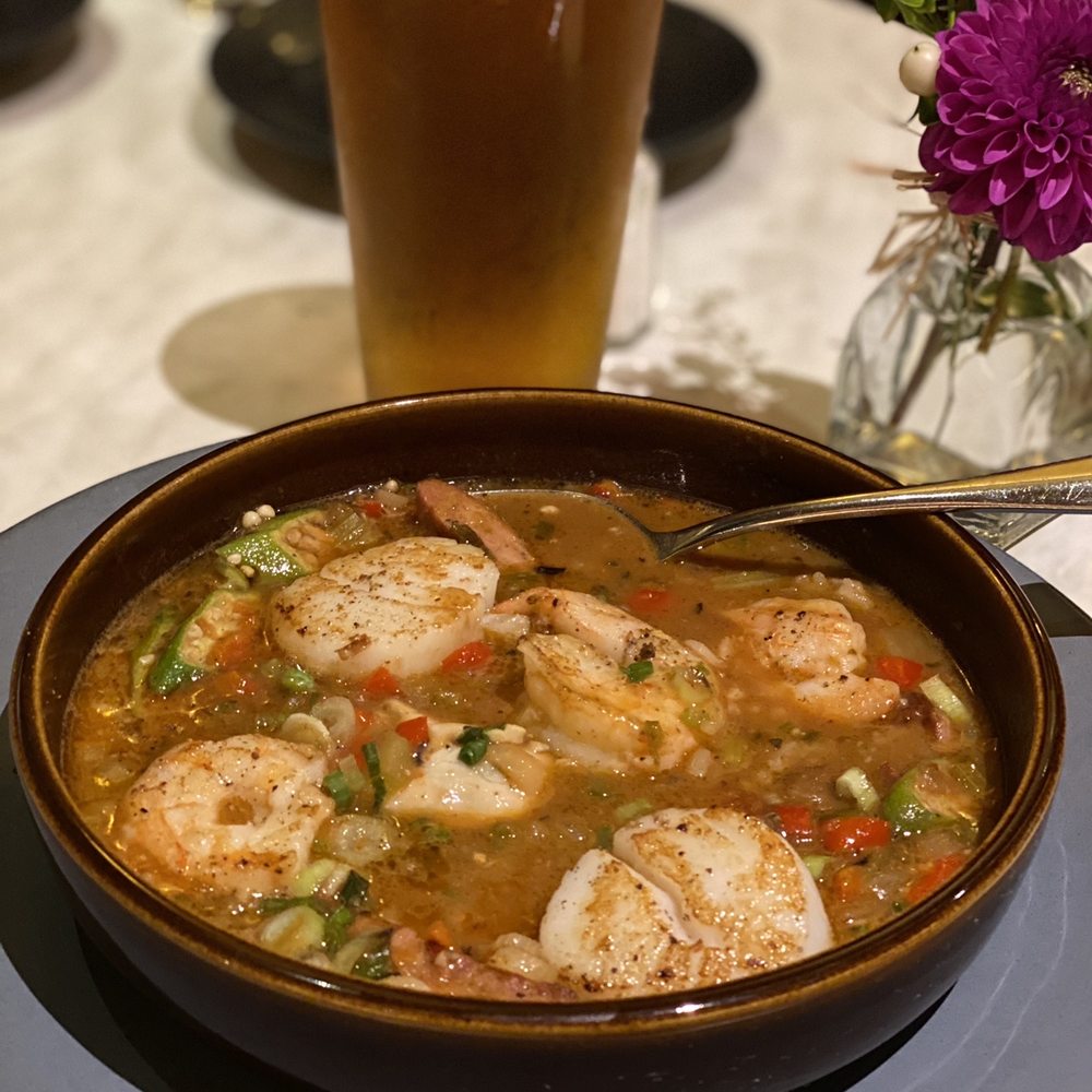 a bowl of soup and a glass of beer