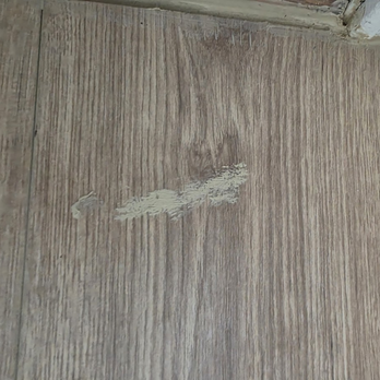 Divinity Renovations - Caulking left all over the flooring. Found caulk on my bathroom sink handles. - Flooring Near Me