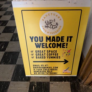 Sanctuary Cafe & Tutoring - Yellow signage leading you to the cafe - Tutoring Centers Near Me - Toronto, Ontario Sanctuary Cafe & Tutoring - Yellow signage leading you to the cafe - Tutoring Centers Near Me - Toronto, Ontario