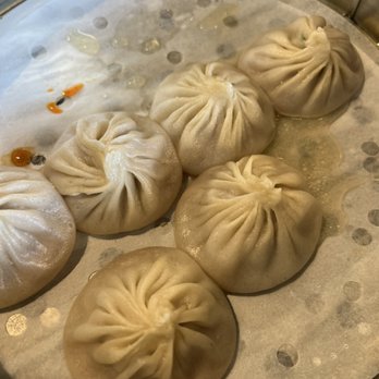 Thumbling - 10/17/2021 Pork Xiao Long Bao. The skin accidentally breaks because they're being steamed too close to each other and all soup spilled - Shanghainese Near Me - West Covina, California