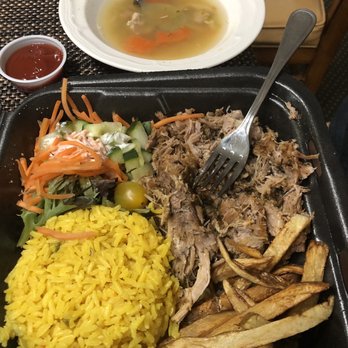 Sofrito Latin Cafe - Roast Pork with fries and yellow rice. Chicken soup on top. - Latin American Near Me - Orlando, Florida Sofrito Latin Cafe - Roast Pork with fries and yellow rice. Chicken soup on top. - Latin American Near Me - Orlando, Florida