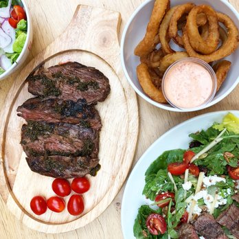 Simon’s Steaks - a salad, onion rings, and a steak - Steakhouses Near Me - Winnipeg, Manitoba Simon’s Steaks - a salad, onion rings, and a steak - Steakhouses Near Me - Winnipeg, Manitoba