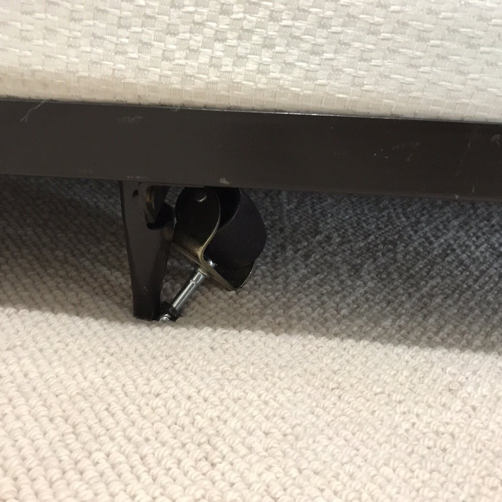 Wheel not snapped back into the bed frame.