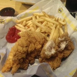 Breaded chicken tenders and fries.