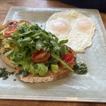 Rafael's Kitchen - Avocado toast with greens, cherry tomatoes, aioli pesto, and two eggs was super delicious - Breakfast & Brunch Near Me - Santa Ana, California Rafael's Kitchen - Avocado toast with greens, cherry tomatoes, aioli pesto, and two eggs was super delicious - Breakfast & Brunch Near Me - Santa Ana, California
