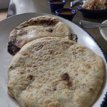 Cuscatlan Salvadorean Cuisine - Two pupusas, mushroom and cheese, and a pork and bean. Two types of salsas, the spicy one was great - Salvadoran Near Me - San Diego, California Cuscatlan Salvadorean Cuisine - Two pupusas, mushroom and cheese, and a pork and bean. Two types of salsas, the spicy one was great - Salvadoran Near Me - San Diego, California