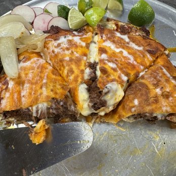 Quesa Loco - The pizza dried as can be. Looked old. - Tacos Near Me - Mt Dora, Florida