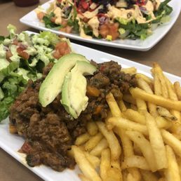Impossible burger piccadillo in the front,  Mexican salad in the back