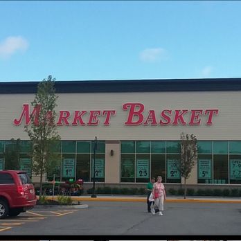 Market Basket - a woman walking in front of the store - Grocery Near Me - Athol, Massachusetts Market Basket - a woman walking in front of the store - Grocery Near Me - Athol, Massachusetts