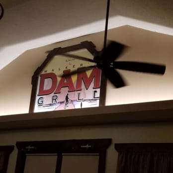 Walker's Dam Grill - a ceiling fan and a sign - Italian Near Me - Lanexa, Virginia