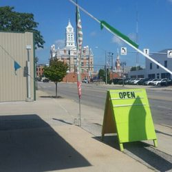 Taco Fam - Signage of small business owner with beautiful Court House in background.