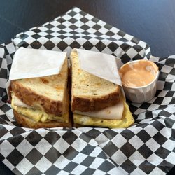 La Casita Mexican Restaurant - The Deeker is what we named it. Jalapeño cheddar toast with Turkey, freshly made crispy bacon, scrambled egg and house made chipotle sauce.