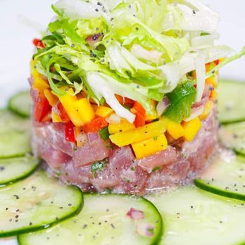 Waterside - a plate of raw tuna with cucumbers and lettuce - New American Near Me - Oxnard, California Waterside - a plate of raw tuna with cucumbers and lettuce - New American Near Me - Oxnard, California