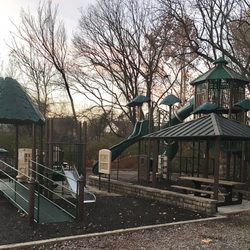 Shady Springs Park - The playground is fenced and next to the picnic pavilion and restrooms.