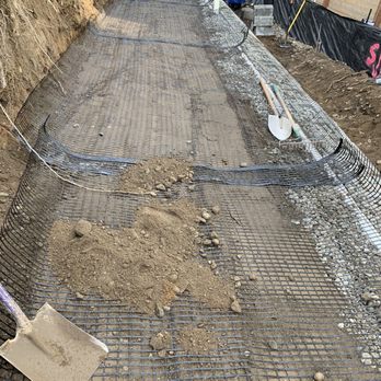 Active Landscaping - a concrete walkway being laid on the side of a building - Landscaping Near Me - Renton, Washington Active Landscaping - a concrete walkway being laid on the side of a building - Landscaping Near Me - Renton, Washington
